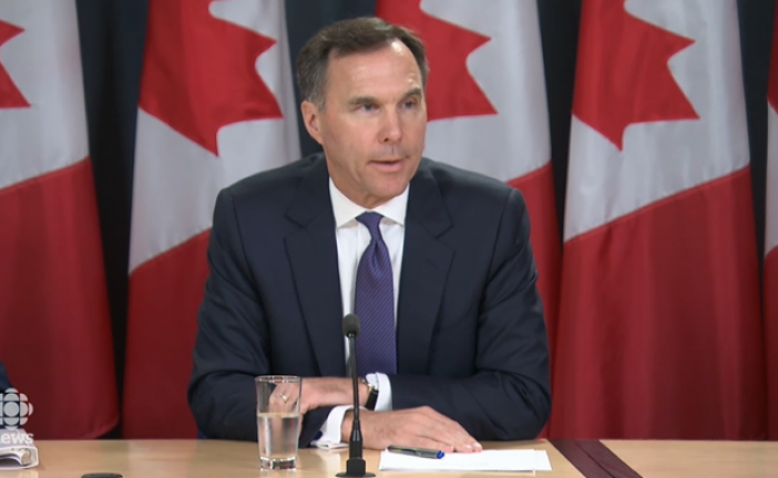 Morneau vows oilpatch support through Trans Mountain as protesters chant outside