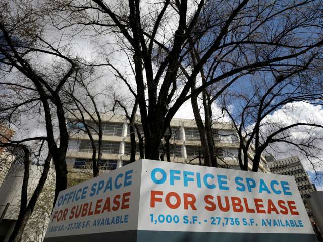 A sign advertising office space for sublease in Calgary.