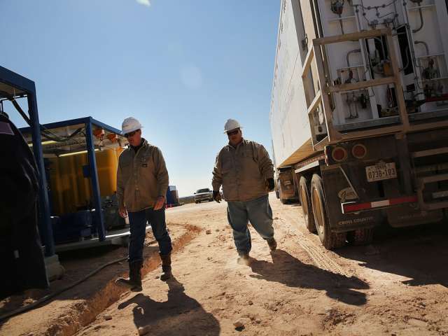 Apache Corp. workers in Texas.