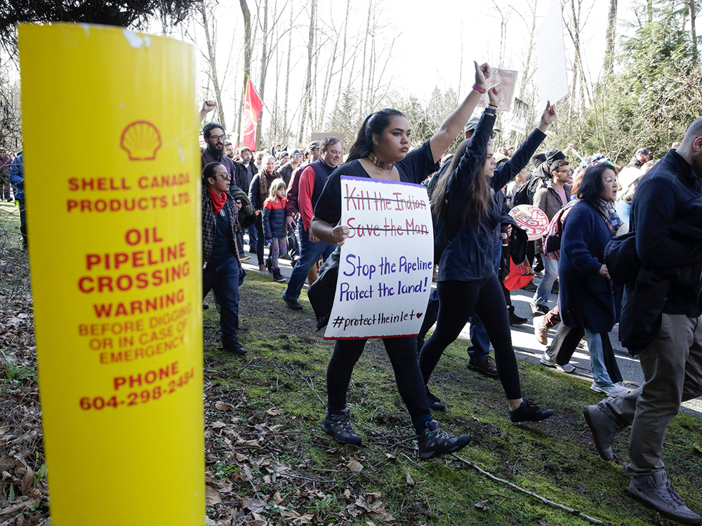  Protesters march against the expansion of the Trans Mountain pipeline in Burnaby, B.C., on March 10, 2018.