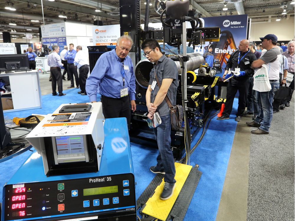  Delegates explore the booths at the Global Petroleum Show in the BMO centre at Stampede Park on Tuesday, June 7, 2016.