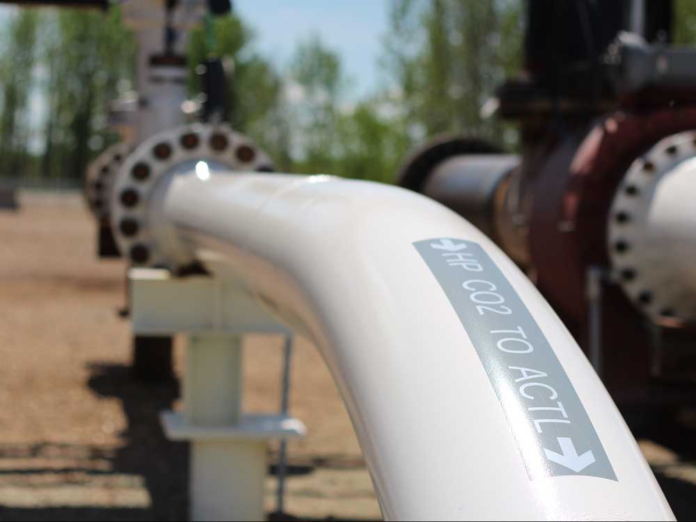  Known as the Alberta Carbon Trunk Line, the pipeline captures carbon dioxide emitted by a bitumen refinery and a fertilizer plant outside Edmonton, and carries it to an oilfield where it is pumped into the ground, where most of it is forever buried, and some is used to increase the amount of oil recovered.