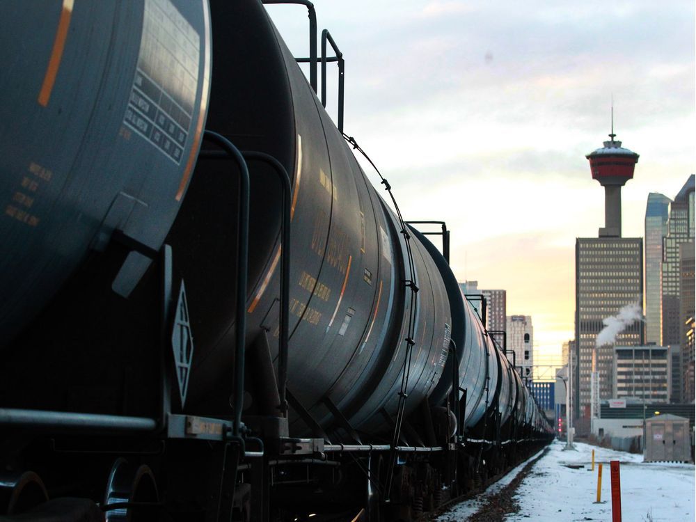  A train carrying oil cars passes through Calgary on Nov. 29, 2018.