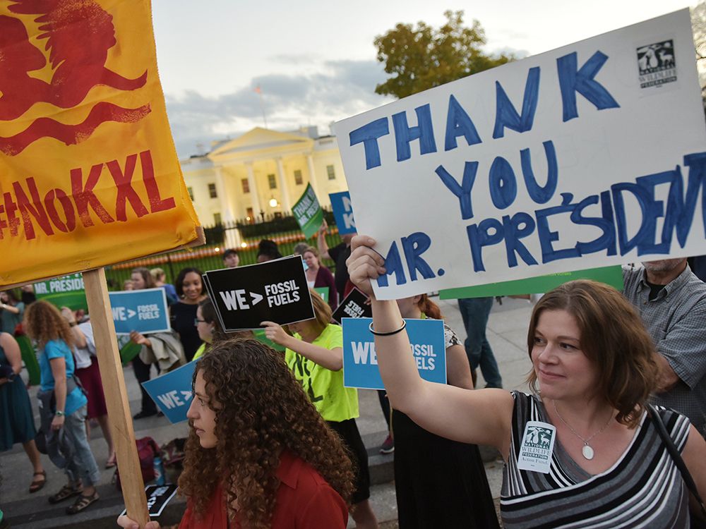  Activists, celebrating US President Barack Obama’s blocking of the Keystone XL oil pipeline, rally in front of the White House in Washington, DC on November 6, 2015. US President Barack Obama blocked the Keystone XL oil pipeline that Canada sought to build into the United States, ruling it would harm the fight against climate change. AFP PHOTO/MANDEL NGANMANDEL NGAN/AFP/Getty Images