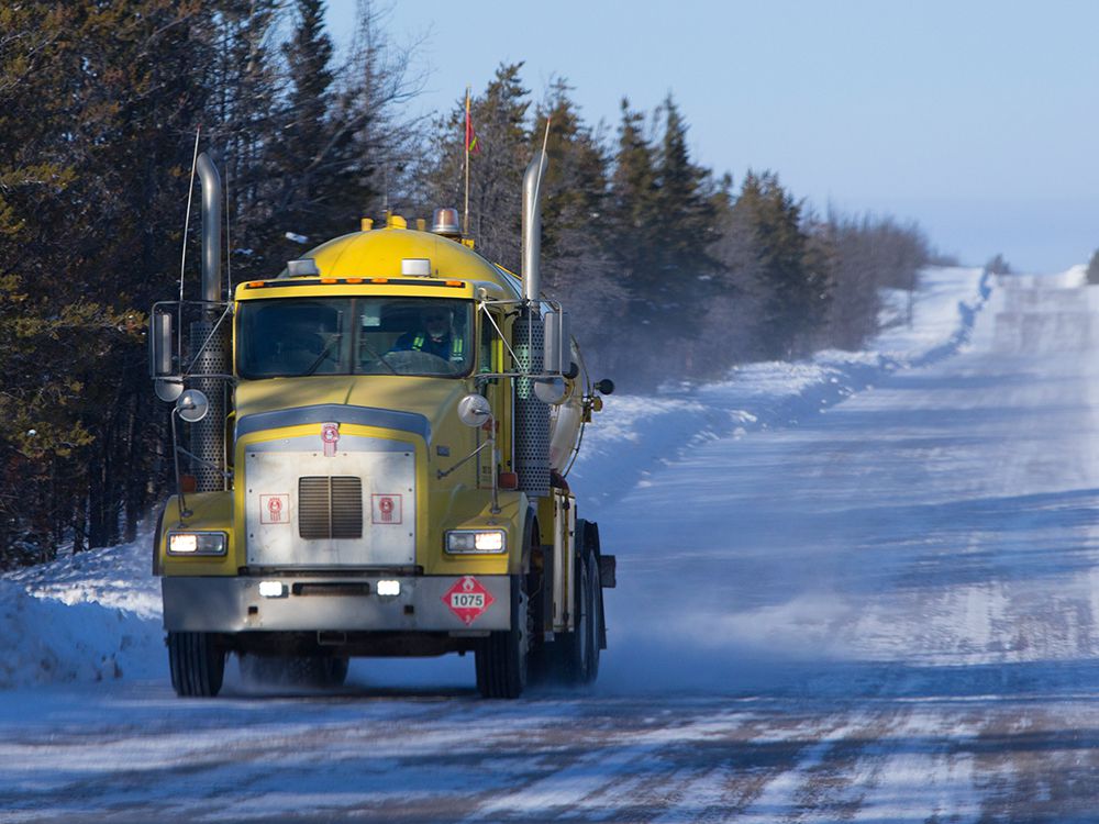  A fuel truck drives down the winter ice road from Fort McMurray to Fort Chipewyan in Northern Alberta on February 4, 2015. The 200-km temporary road typically opens mid-December and closes mid-March depending on the weather.