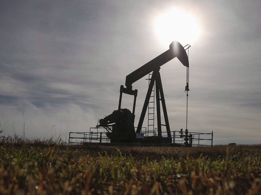  A pumpjack works at a well head on an oil and gas installation near Cremona, Alta.