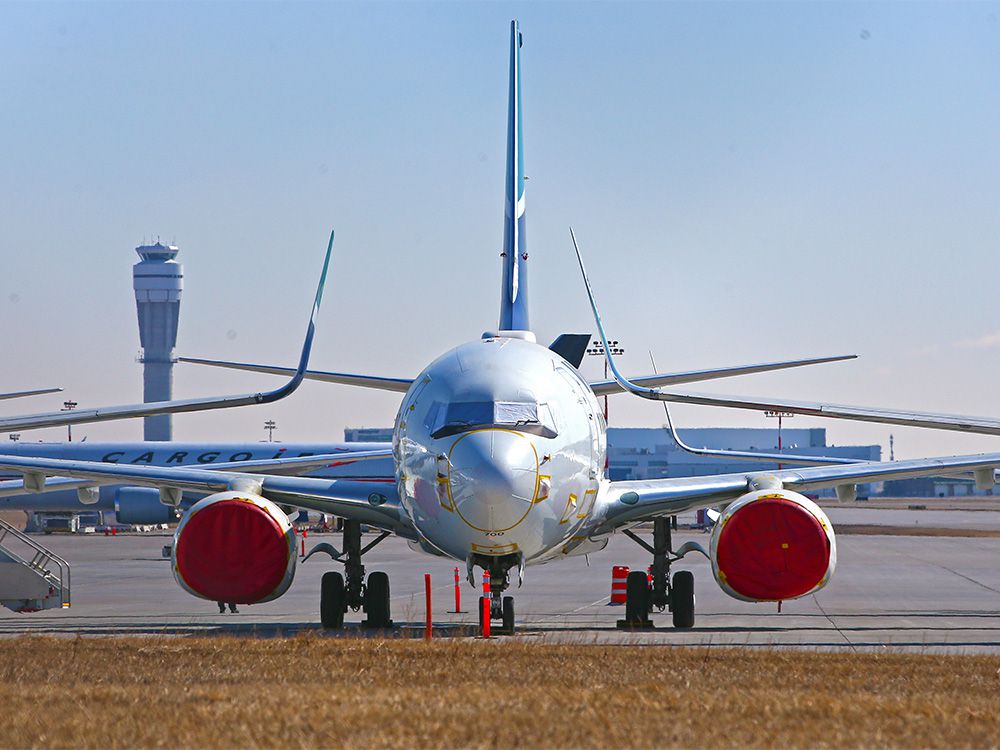  WestJet Boeing 737 aircraft are seen in storage at the Calgary International Airport on Tuesday, March 23, 2021.