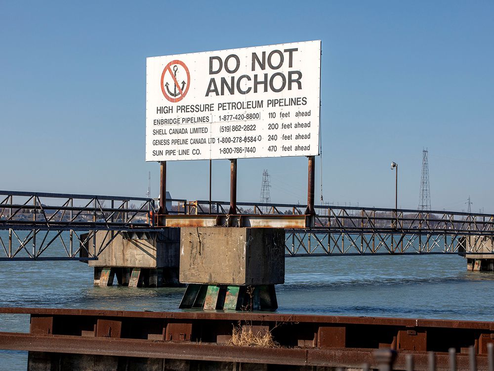  A signpost marks the presence of high pressure petroleum pipelines including Enbridge’s Line 5 pipeline, which Michigan Governor Gretchen Whitmer ordered shut down in May 2021, in Sarnia, Ontario, Canada March 20, 2021. Picture taken March 20, 2021.