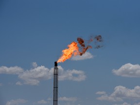 A flare burning off excess gas at an oil production site.