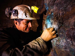 A miner works at a copper mine in Chile.