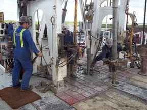 Roughnecks operate a drilling rig for Crescent Point Energy in Saskatchewan in 2012.