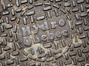 Hydro-Quebec signage is displayed on a manhole cover in Montreal.