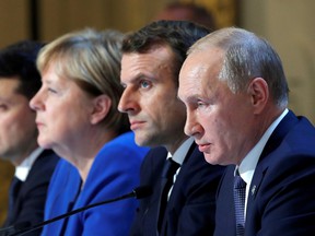 Vladimir Putin with French President Emmanuel Macron and German Chancellor Angela Merkel in 2019.