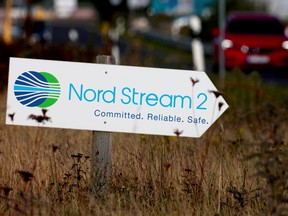 A road sign directs traffic towards the Nord Stream 2 gas line landfall facility entrance in Lubmin, Germany.