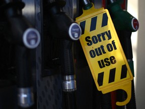 An out of use sign is attached to a pump at an Esso petrol station in east London, U.K.