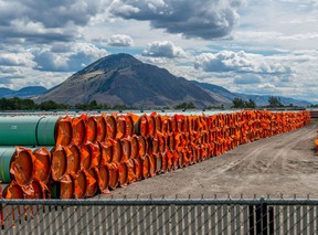 Steel pipe to be used in the oil pipeline construction of the Canadian government’s Trans Mountain Expansion Project lies at a stockpile site in Kamloops, British Columbia.