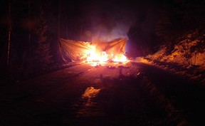 RCMP officers approaching the site from the Marten Forest Service Road said they encountered a burning blockade of downed trees, tar-covered stumps, wire and boards with spikes driven through them.