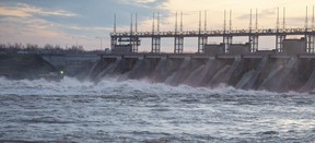 Water rushes through a hydro electric dam in Carillon, Quebec. Industrial customers in Quebec pay anywhere from 30 to 80 per cent less for electricity than they would in Ontario.