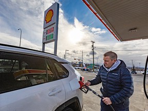 Cliff Cullen fills up at a Shell station on 16th Avenue N.E..