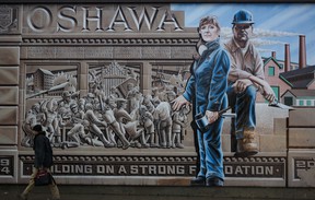 A mural in Oshawa, Ontario. depicts the city’s more than century-long history of making automobiles.