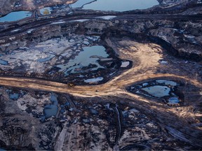 FILE PHOTO: The Suncor Energy Inc. Millennium mine is seen in this aerial photograph taken above the Athabasca oilsands near Fort McMurray, Alberta.