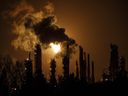 A flare stack lights the sky from the Imperial Oil refinery in Edmonton on Dec. 28, 2018. 