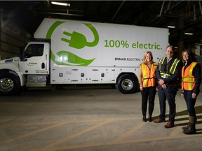 Heather Stephens, COO with Emissions Reduction Alberta, Rod Hayes with Glover International and Jana Mosley, president Enmax Power were on hand as Enmax unveiled thier two fully electric medium duty fleet vehicles on Monday, April 11, 2022. Enmax is the first utility in Canada to pilot these trucks as part of the goal to electrify its mobile fleet. Gavin Young/Postmedia