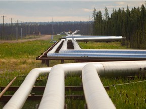 Pipelines carrying steam, gas and an emulsion of bitumen and water snake through the boreal forrest from well pads to the Cenovus Energy steam assisted gravity drainage oilsands facility near Conklin, Alta.