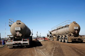 A tanker trucks used to haul oil products operate at an oil facility near Brooks.