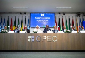 Representatives of OPEC member countries attend a press conference after meeting in Vienna on Oct. 5.