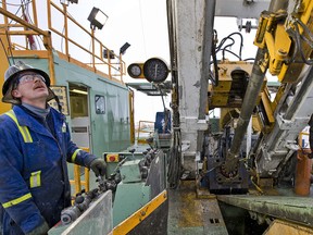 Ian Van Egmond, a worker for Precision Drilling, is shown at a gas well near Alix, Alta., in this file photo.