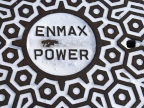 An Enmax manhole cover is shown in downtown Calgary on Wednesday, December 21, 2022. A good part of western Canada is under severe weather warnings. Jim Wells/Postmedia