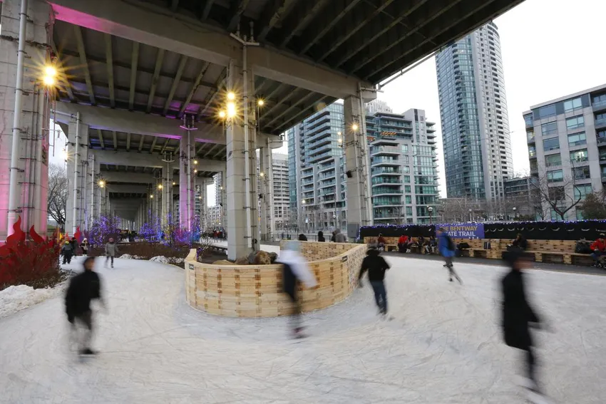 Visitors skate along the Bentway Skate Trail under the Gardiner in Toronto
