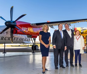 Sherry Brydson, far right, owner of De Havilland Canada, with her husband Rob McDonald stand next to then-premier Jason Kenney and Wheatland County Reeve Amber Link at a press conference in Calgary on Sept. 21.