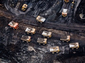 Heavy haulers are seen at the Fort Hills oilsands mine near Fort McMurray. The oil and gas sector is the largest emitting industry in Canada.