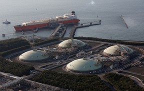 Liquefied natural gas storage tanks and tanker are seen at the Futtsu Thermal Power Station east of Tokyo on Feb. 20, 2013.