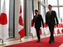 Prime Minister Justin Trudeau and Japanese Prime Minister Kishida Fumio walk together after a news conference on Thursday in Ottawa.