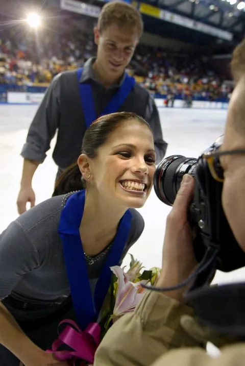 Jamie Salé leans in to smile for a photographer after she and David Pelletier received their gold medals for the pairs competition at the ISU Grand Prix Final in Kitchener on Dec. 15, 2001.