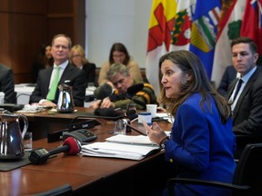 Chrystia Freeland, right, speaks with the provincial finance ministers during a meeting in Toronto on Friday, February 3, 2023.