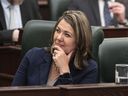 Alberta Premier Danielle Smith watches as Finance Minister Travis Toews delivers the 2023 budget, in Edmonton on Tuesday, Feb. 28, 2023.