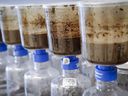 Tailings samples are being tested during a tour of Imperial's oil sands research centre in Calgary on Aug. 28, 2018. A Calgary-based lawyer says Alberta's energy regulator may have ignored provincial law by not publicly disclosing that waste from a large oilsands tailings pond was escaping containment and seeping into groundwater.
