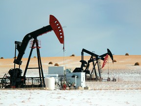 Three operational pumpjacks adjacent to Sunset Ridge and Highway 22 battle through the winter chill on Dec. 6, 2019.