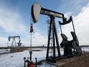 Idle oil pump jacks are seen in a field near Leduc, Alta., on Friday March 4, 2016.