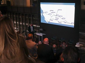 Guests watch a video detailing the announcement of a $70-million joint development agreement between Tourmaline Oil and Clean Energy to build CNG stations in Western Canada. The announcement was made in Calgary on Tuesday, April 18, 2023.