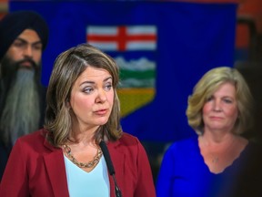 UCP leader Danielle Smith appears with Calgary-Glenmore UCP candidate Whitney Issik during a campaign announcement at Braeside Automotive on Thursday.