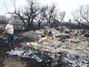 Property owner Adam Norris surveys the damage at his home outside the town of Drayton Valley, Alberta, on May 08 2023. 