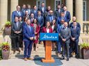 Alberta Premier Danielle Smith poses for a picture with members of her cabinet on Friday, June 9.