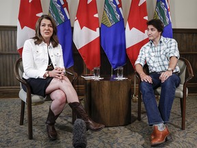 Prime Minister Justin Trudeau, right, meets with Alberta Premier Danielle Smith in Calgary on Friday, July 7, 2023.