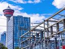 Enmax power lines are seen with the Calgary skyline as a backdrop on Tuesday, August 16, 2022. 