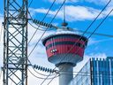 Enmax power lines are seen with the Calgary Tower as a backdrop on Tuesday, August 16, 2022. 